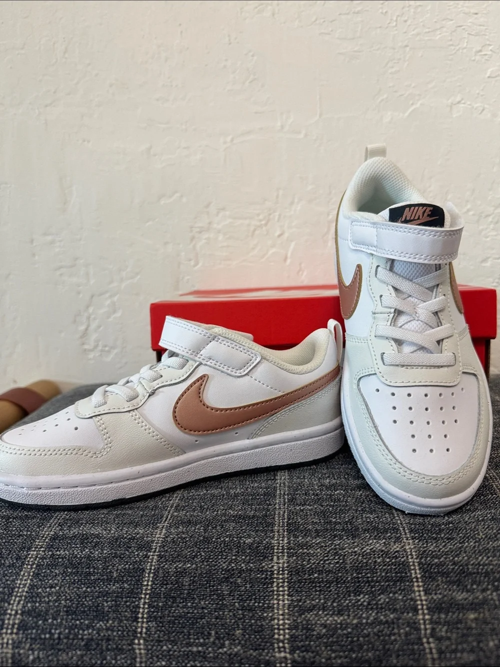 Nike Kids White Sneakers with Gold Swoosh
